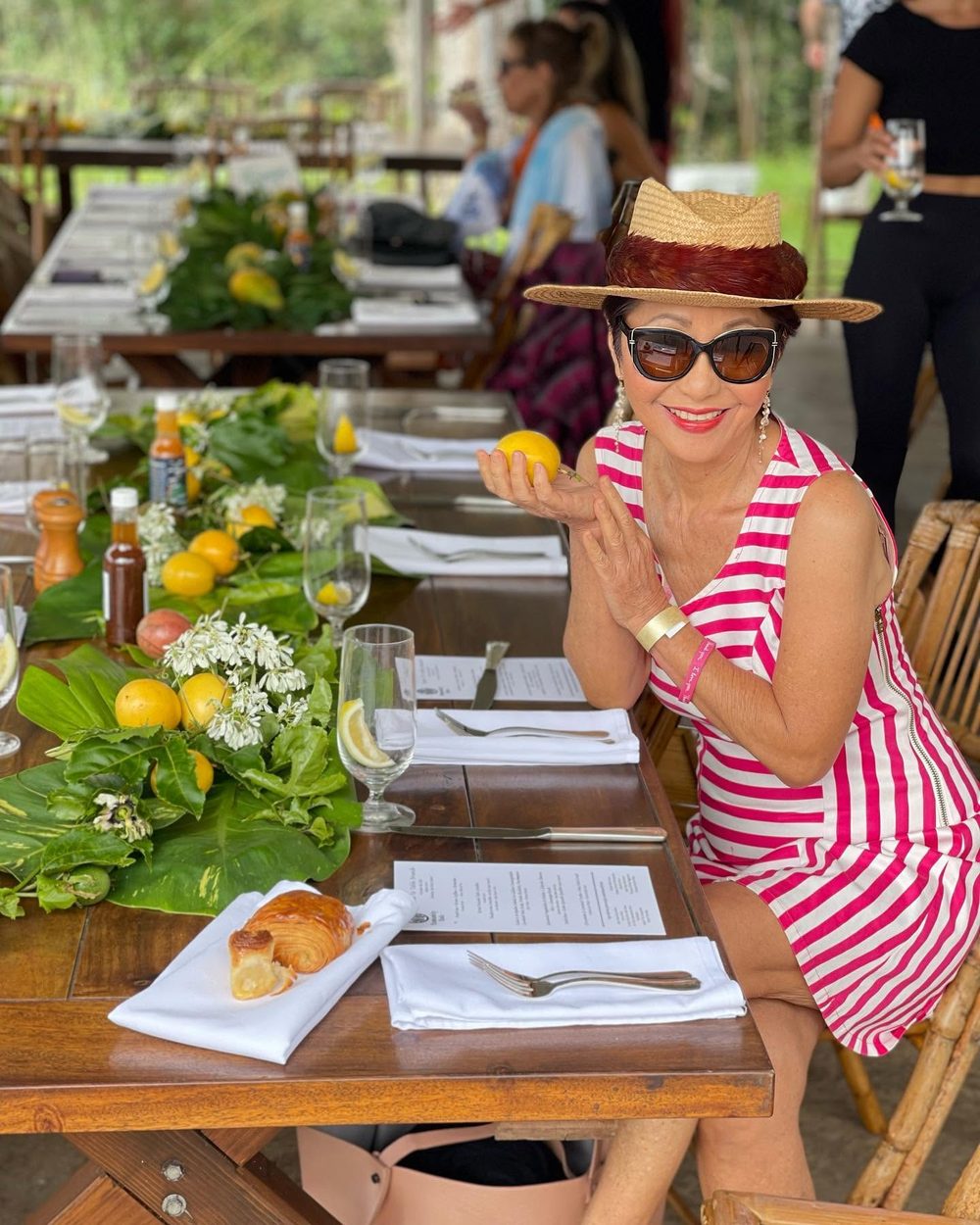 Olelo paʻa at a long outdoor table set for a shared meal
